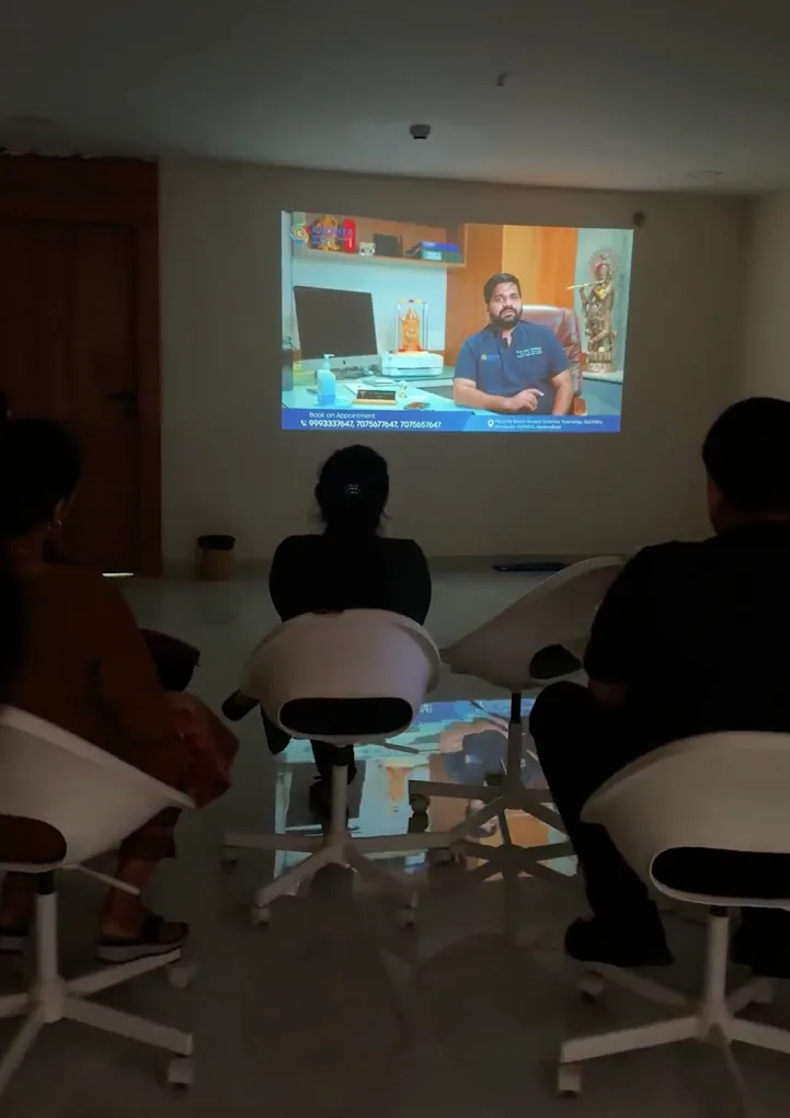 SpaceKey team reviewing a cut projected on the office wall